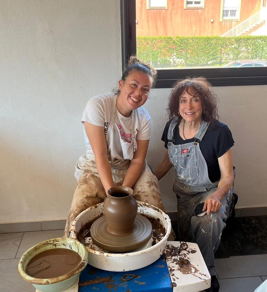 Lauren teaching pottery in studio